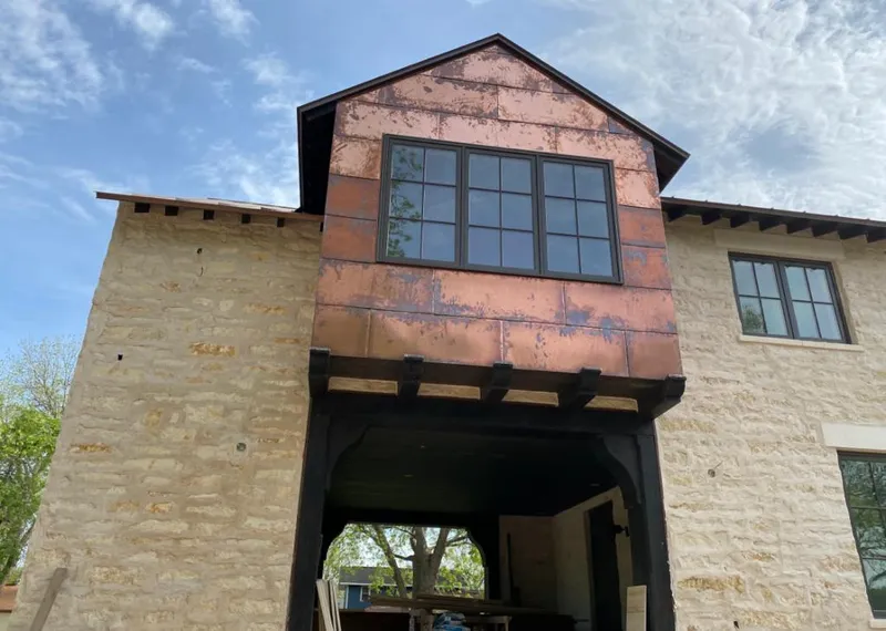 Copper metal panel facade on a stone building for Metal Roof Coating in Redlands