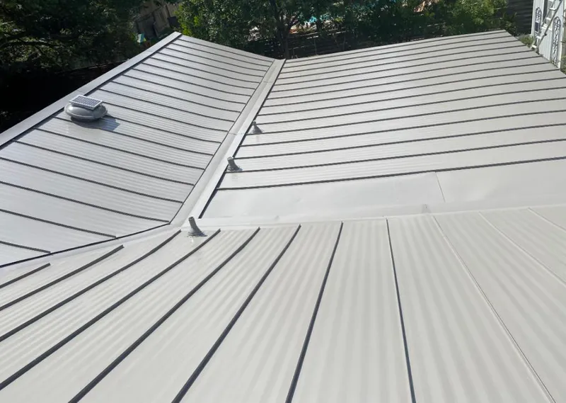Solar attic fan installed on a metal roof for Roof Ventilation in Redlands